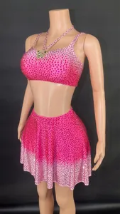 Fuchsia two-piece set with rhinestone-embellished crop top and mini skirt, gradient style