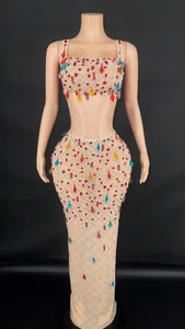 Detail of colorful rhinestones and mesh texture on this two-piece sexy party dress