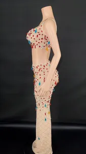Side view of sexy rhinestone two-piece mesh transparent party dress on mannequin