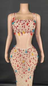 Detail of two-piece mesh dress with colorful rhinestones for party wear