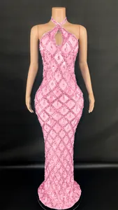 Detailed view of pink halter gown with sequin diamond grid and sparkling rhinestone drops