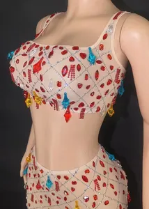 Detail view of the mesh two-piece set featuring colorful rhinestones for party wear.