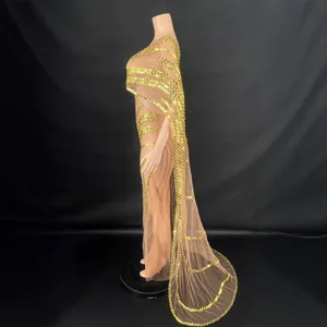 Elegant sequined mesh evening gown with cape design shown in profile view