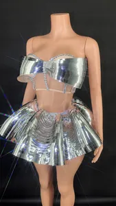 Close-up of silver mirror stage costume with rhinestones for nightclub performance.
