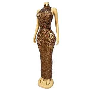 Sparkling gold sequin floor-length gown for evening gala and formal party celebrations.