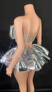 Back detail of silver mirrored performance dress with rhinestone corset and tiered skirt