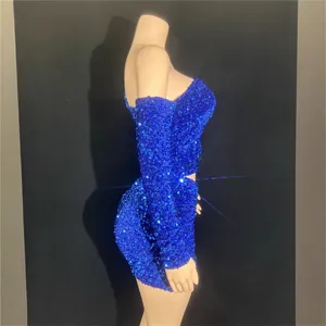 Royal blue sequined off-shoulder bodycon mini dress with long sleeves on mannequin display