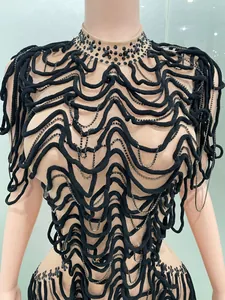 Close-up of mesh party evening top with black wave texture and rhinestone details for women