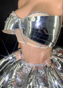 Detail of metallic mirror stage costume with rhinestones and brilliant star flares