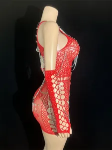 Side view of red fishnet bodycon dress with metal chain and safety pin decoration