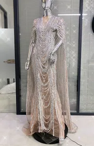 Detailed view of the intricate rhinestone beading on the sheer mesh banquet dress.