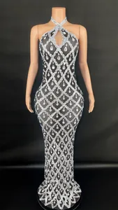 Elegant halter neck floor-length pageant dress with intricate silver rhinestone diamond patterns