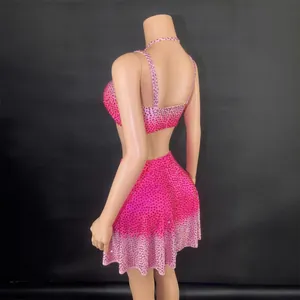 Sexy rose red rhinestone two-piece set with a backless crop top and puffy mini skirt