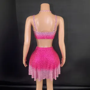 Rose red rhinestone crop top and mini skirt set shown from the back view