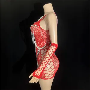 Red hollow-out backless mini dress with punk style chain and pearl decor on mannequin