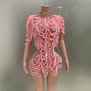 Unique pink 3D textured mini dress with rhinestone details for party and clubwear events.