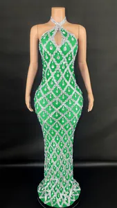 Green halter neck floor-length dress with silver sequins and teardrop crystals
