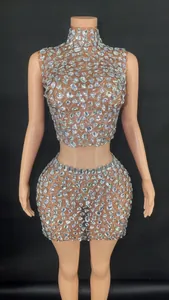 Close-up detail of high-neck sleeveless rhinestone crop top and bodycon skirt set