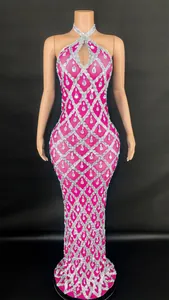Detail of a pink halter neck dress with silver lattice and teardrop crystal embellishments