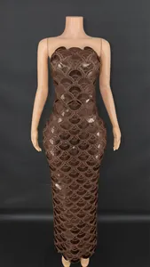 Detail of brown sequin floor-length dress with scallop fish scale pattern