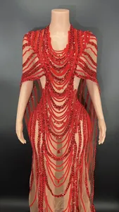 Detail view of red sequined sheer mesh bodycon dress with elegant long cape sleeves