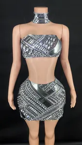 Detailed view of glittering silver rhinestone two-piece set with tube top and mini skirt