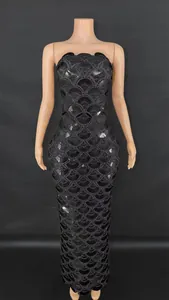 Full length view of black heavy-duty sequined bodycon maxi dress with shell pattern