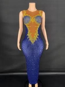 Elegant royal blue slim fit long dress with gold rhinestone embellishments for performances.