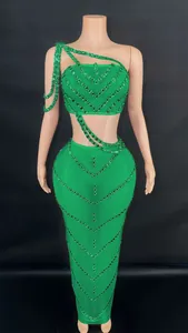Front view detail of a green rhinestone crop top and bodycon maxi skirt set on mannequin
