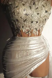 Close-up of sparkling sequined top and pleated mini skirt set with elegant texture