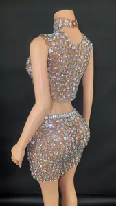 Detailed close-up of sparkling rhinestone crop top and bodycon skirt set