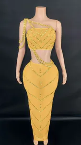 Sexy yellow two-piece set with gold rhinestone embellishments and long bodycon skirt