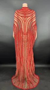 Back view of a red sequined sheer mesh evening gown with elegant cape sleeves