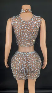 Detailed back view of a sheer mesh rhinestone crop top and mini skirt set