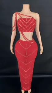 Detail view of red rhinestone two-piece set with V-shaped patterns on bodycon skirt