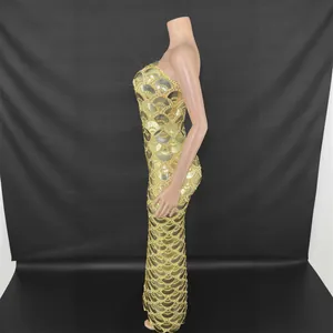 Elegant gold sequined strapless mermaid gown for evening parties and gala events.