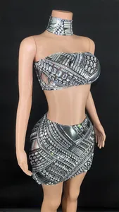 Detailed view of silver rhinestone bandeau top and high waist mini skirt set on mannequin