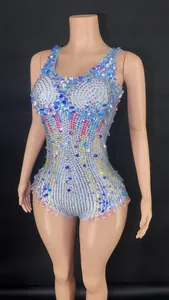Close-up detail of iridescent rhinestones and sequins on stage performance bodysuit