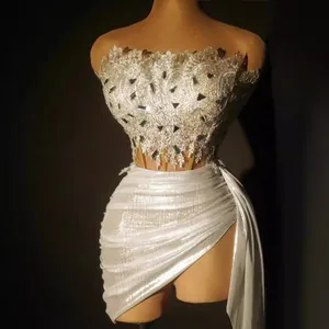 Elegant silver sequin off-shoulder mini top and pleated high-waisted mini skirt set for women