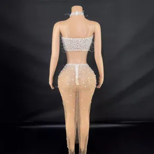 Elegante set met parels en strass versierde top en transparante rok voor luxe feesten