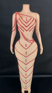 Detail view of sexy nude mesh two-piece set with red rhinestone V-patterns on mannequin