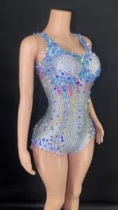 Close-up of sparkling sequined performance bodysuit with colorful rhinestone details