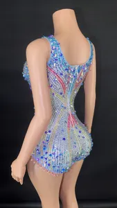 Back view of a sparkling blue bodysuit with multi-colored rhinestones for stage performance.