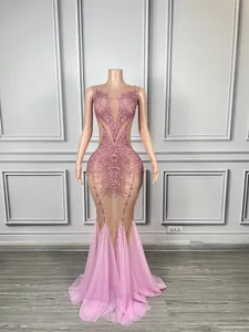 Close-up detail of a pink sequined mermaid dress with mesh panels for stage and performance
