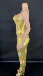 Side profile detail of a glamorous gold metallic evening gown with rhinestone encrusted bust