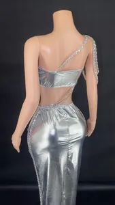 Detail view of the backless silver metallic crop top and long rhinestone skirt set on a mannequin