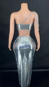 Detailed back view of a silver metallic crop top and rhinestone long bodycon skirt set