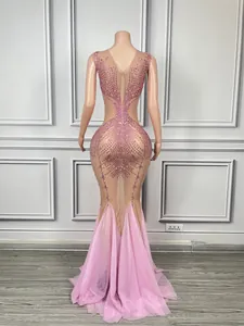 Back detail of pink mermaid gown with sparkling rhinestones and sheer mesh panels