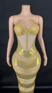 Detailed view of glamorous gold rhinestone striped bodycon evening gown with mesh panels