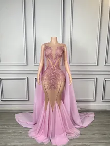 Elegant pink sequin mermaid gown with deep V neckline and cape for stage performers